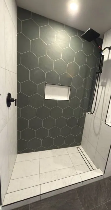 Custom shower with a green hexagon feature wall